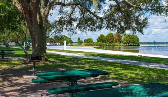 view of home's community with a yard and a water view