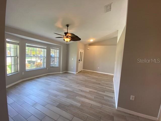 spare room with ceiling fan and light hardwood / wood-style flooring