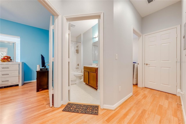 hall with light wood-type flooring