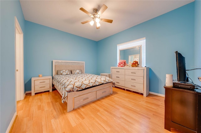 bedroom featuring light hardwood / wood-style flooring and ceiling fan