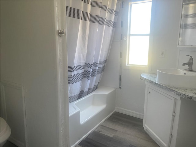 full bathroom featuring toilet, vanity, shower / tub combo, and hardwood / wood-style flooring