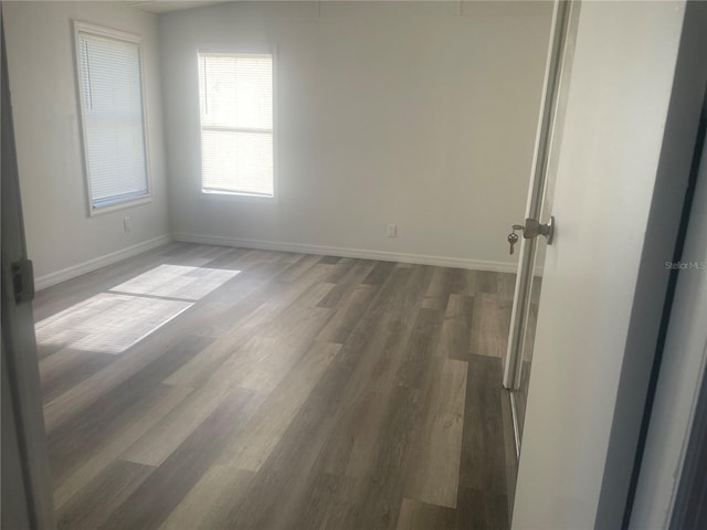 spare room featuring dark hardwood / wood-style floors