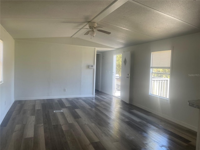 unfurnished room featuring ceiling fan, dark hardwood / wood-style flooring, and vaulted ceiling