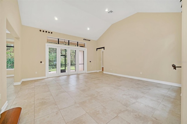 1233 Aquila Loop, Celebration, FL 34747 - unfurnished room with light tile patterned flooring, french doors, recessed lighting, baseboards, and high vaulted ceiling