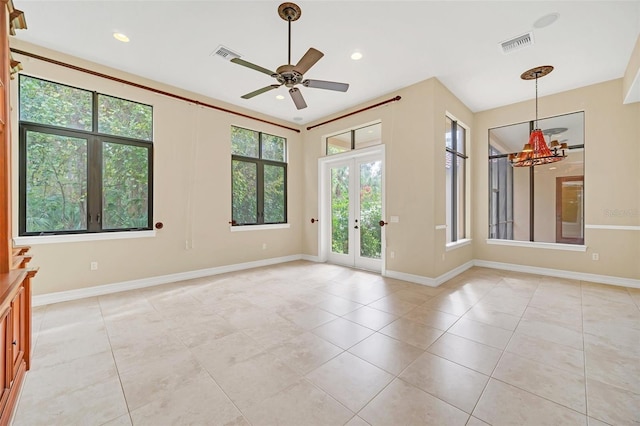 spare room featuring ceiling fan, french doors, and light tile patterned floors