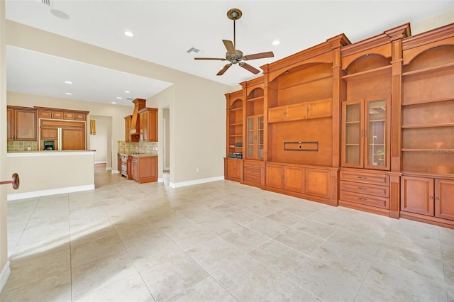 unfurnished living room featuring ceiling fan and light tile patterned floors