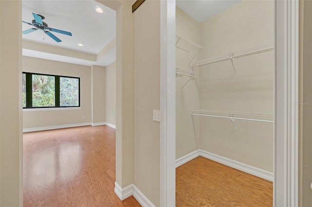 1233 Aquila Loop, Celebration, FL 34747 - spacious closet featuring wood finished floors and a ceiling fan