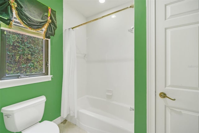 1233 Aquila Loop, Celebration, FL 34747 - bathroom featuring toilet, shower / bath combination with curtain, baseboards, and tile patterned flooring