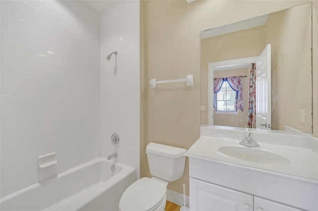 full bathroom with vanity, toilet, and tiled shower / bath