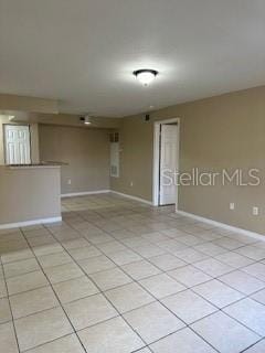 empty room with light tile patterned floors