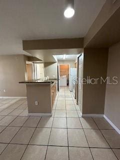 kitchen with light tile patterned floors