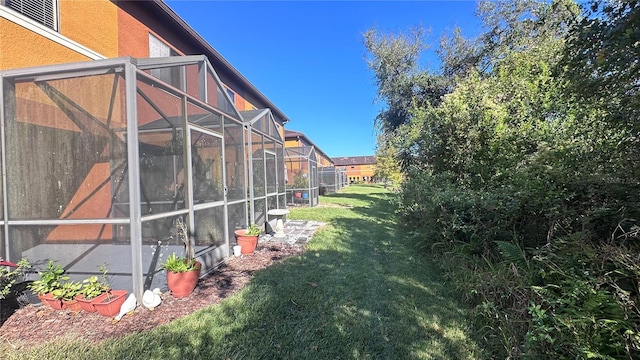 view of yard featuring a lanai