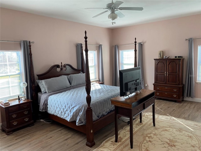 bedroom featuring light wood-type flooring and ceiling fan