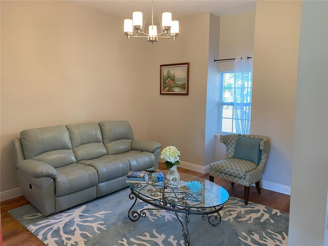 living room featuring a chandelier and hardwood / wood-style floors