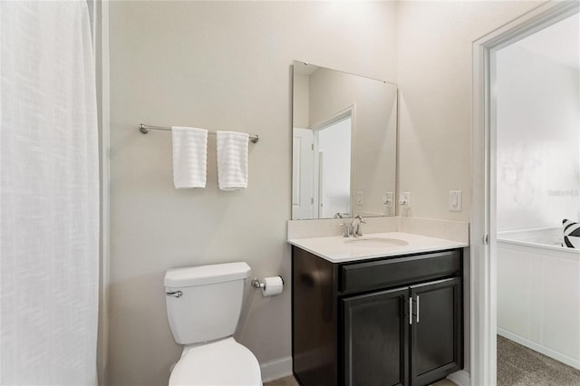 bathroom featuring vanity and toilet