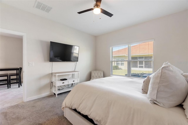 bedroom with ceiling fan and carpet floors