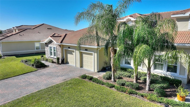 view of front of home with a garage and a front yard