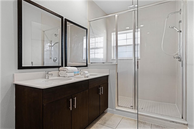 bathroom with tile patterned flooring, vanity, and a shower with shower door