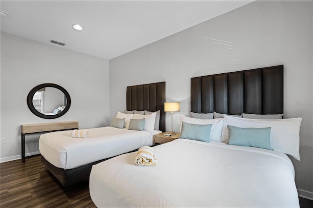 bedroom featuring dark hardwood / wood-style flooring