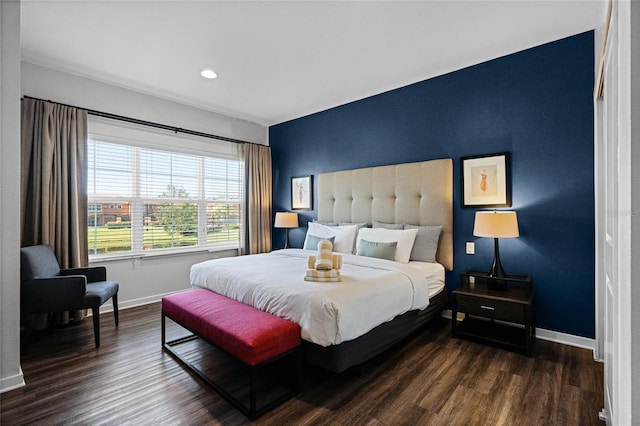 bedroom featuring dark hardwood / wood-style flooring