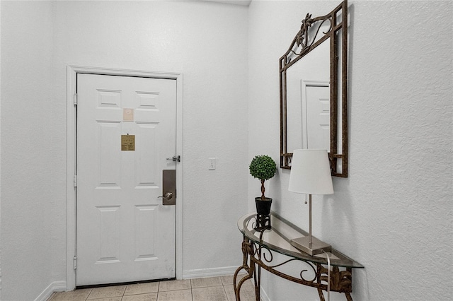 foyer entrance featuring light tile patterned floors