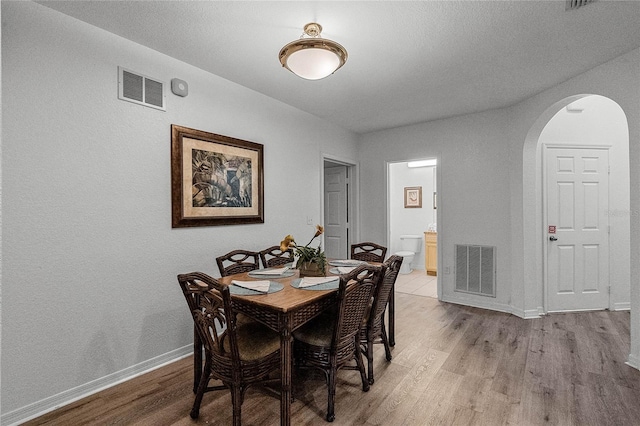 dining area with light hardwood / wood-style floors