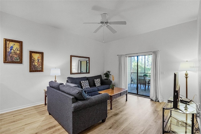 living room featuring ceiling fan and light hardwood / wood-style flooring