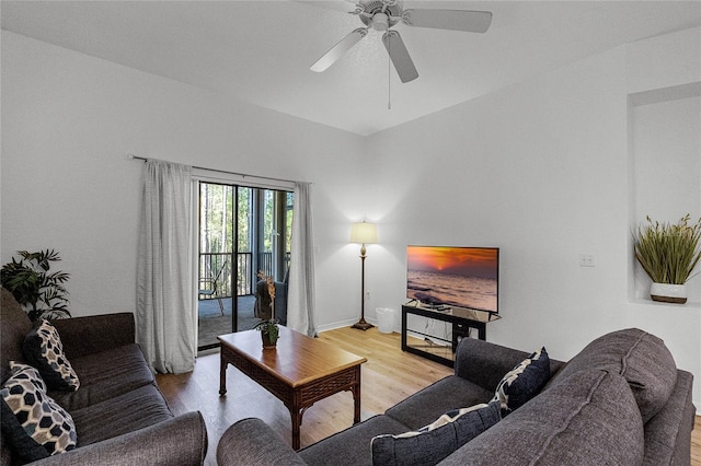 living room featuring light wood-type flooring and ceiling fan