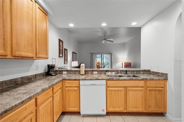 kitchen featuring kitchen peninsula, ceiling fan, sink, light tile patterned floors, and dishwasher