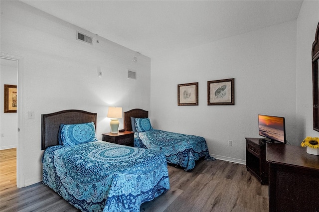 bedroom featuring hardwood / wood-style flooring