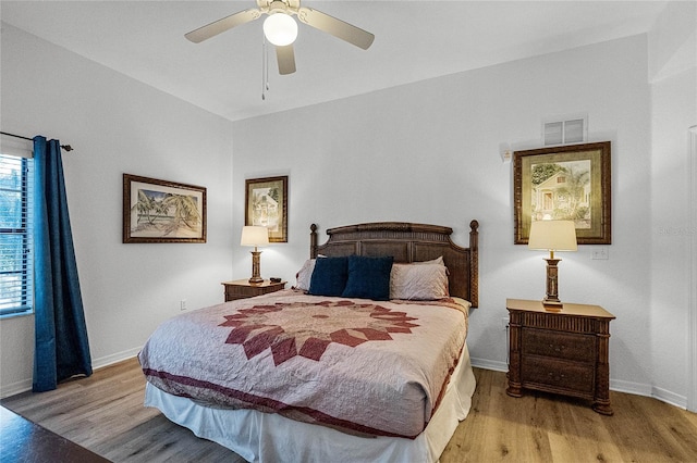 bedroom with ceiling fan and light wood-type flooring