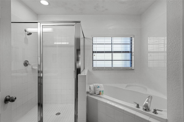 bathroom featuring plus walk in shower