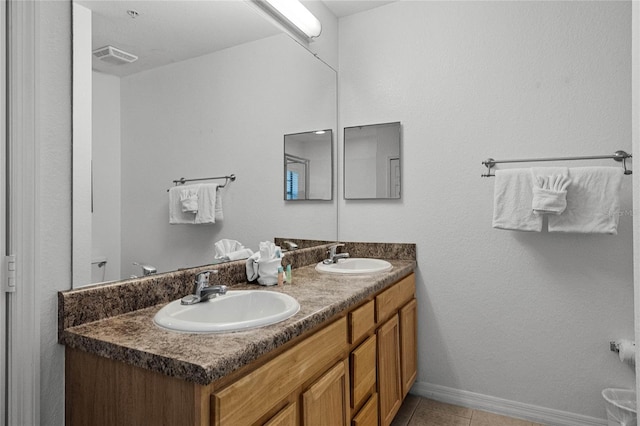 bathroom with vanity and tile patterned floors