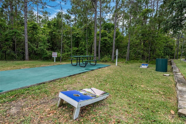 view of property's community with a yard