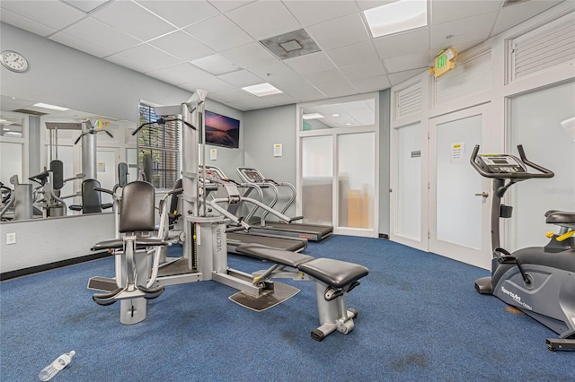 workout area with a drop ceiling