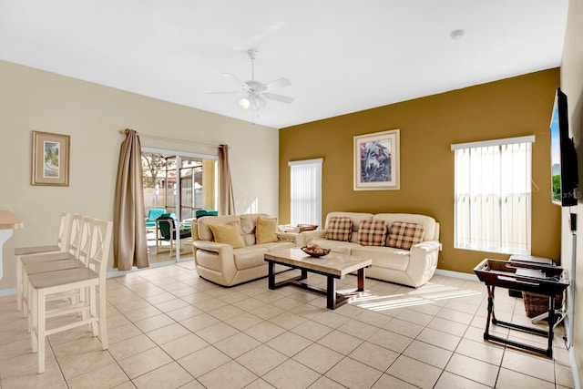 tiled living room with ceiling fan