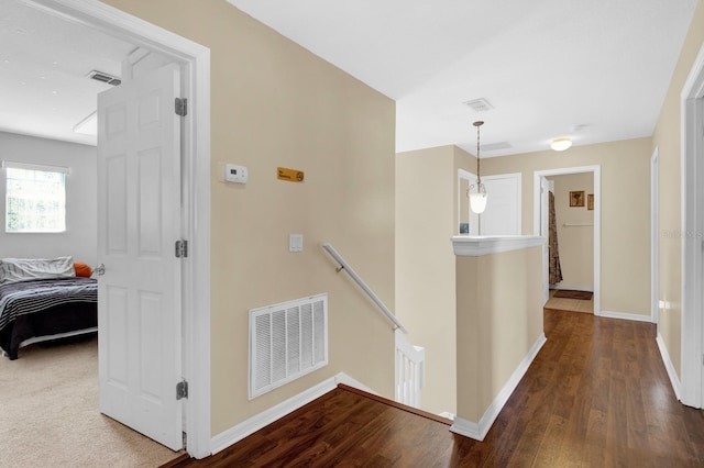 corridor featuring wood-type flooring