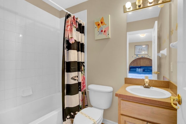 full bathroom featuring shower / bath combo with shower curtain, vanity, and toilet