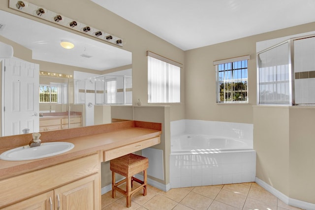 bathroom with shower with separate bathtub, vanity, and tile patterned floors