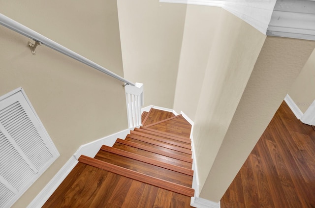 stairs with hardwood / wood-style flooring