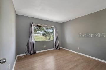 unfurnished room featuring light hardwood / wood-style flooring