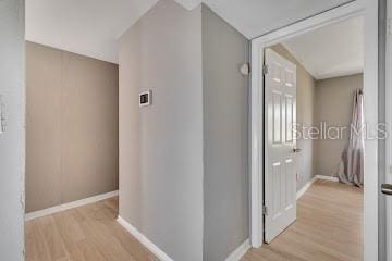 hall with light hardwood / wood-style floors