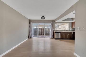 interior space featuring light hardwood / wood-style flooring and stainless steel dishwasher