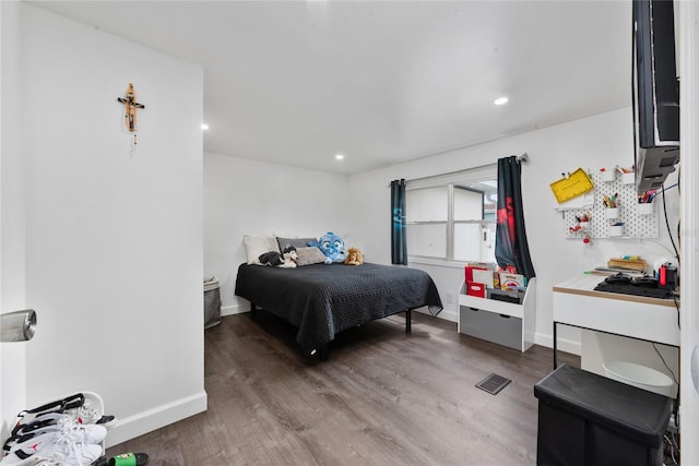 bedroom featuring hardwood / wood-style flooring