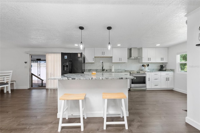 kitchen featuring electric range, wall chimney exhaust hood, dark hardwood / wood-style flooring, black fridge with ice dispenser, and white cabinets