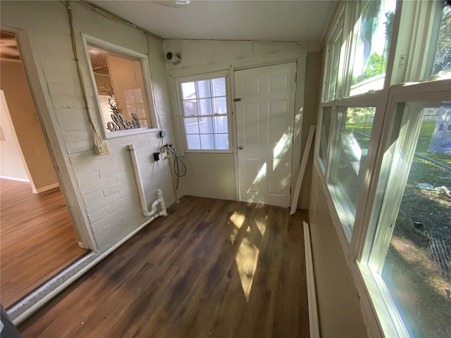 unfurnished sunroom with vaulted ceiling