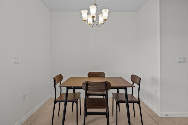 dining space with a chandelier and light tile patterned floors