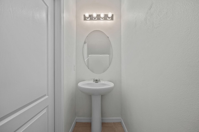 bathroom with tile patterned floors