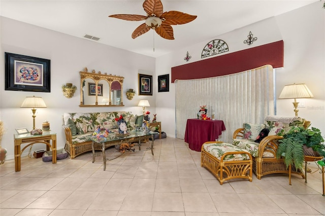 sitting room with ceiling fan and light tile patterned floors