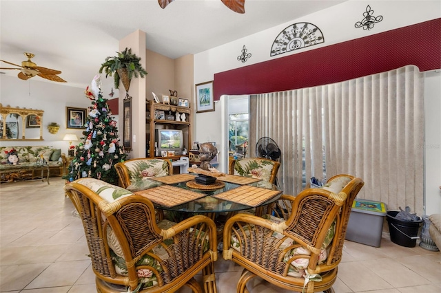 tiled dining room featuring ceiling fan